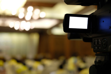 video production camera recording live event on stage. television social media broadcasting seminar...