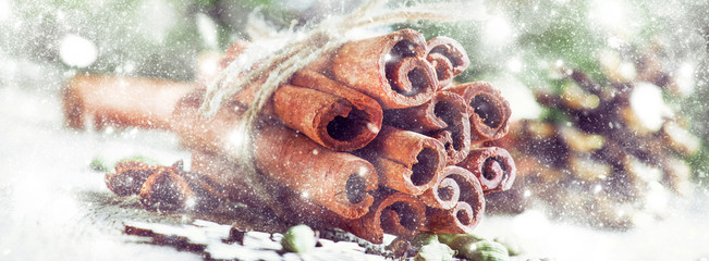 New Year or Christmas composition with spices for making hot winter drink, cinnamon, cardamom,...