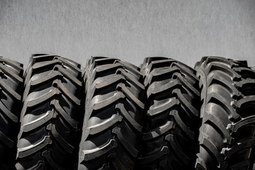 Naklejka premium Tractor tires wheels closeup pattern