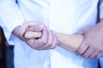 Doctor holding touching hands Asian senior or elderly old lady woman patient with love, care, helping, encourage and empathy at nursing hospital ward : healthy strong medical concept 