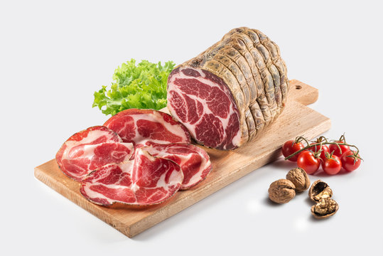Cutting board with air-cured pork meat coppa