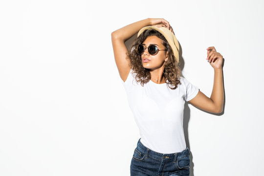 Young Curly Latin Woman In Sunglasses And Straw Hat Isolated Over White Background