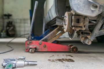 Closeup detail of the wheel assembly on a modern automobile. The rim is removed showing the front...