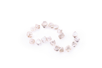 natural transparent diamonds in macro on a white background