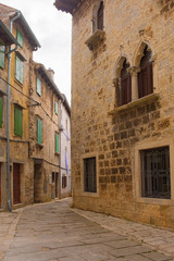Fototapeta na wymiar A street in the historic village of Vodnjan (also called Dignano) in Istria, Croatia 