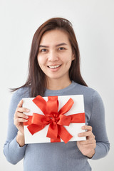 Young woman happy hold gift box in hands