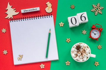 calendar December 6th cup cocoa and marshmallow, empty open notepad