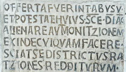 Latin inscription on ancient wall of Church of Santa Maria in Cosmedin in Rome, Italy