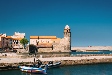 Collioure, France. Boats Moored On Berth Near The Church Of Our 
