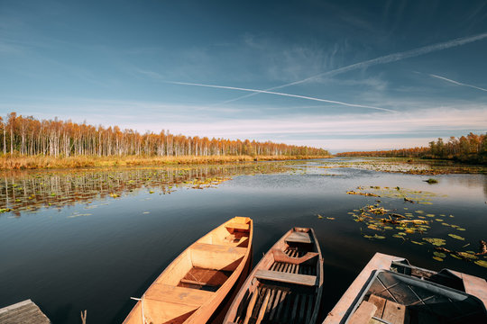 Lake Or River And Old Wooden Rowing Fishing Boats In Beautiful A