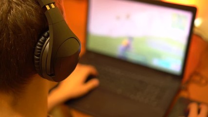 Young man plays video game