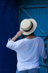 beautiful young woman in straw boater hat