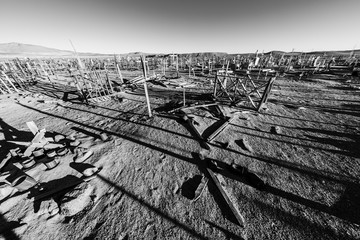 Amazing view over an old and abandoned saltpeter people cemetery inside the awesome Atacama Desert, loneliness to rest in peace in a remote location during the sunset hour. Taltal, Chile
