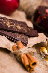 Black chocolate on the fabric. Nuts, cinnamon, red apple, coffee.