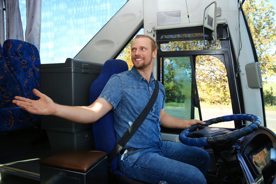 Professional bus driver at steering wheel. Passenger transportation