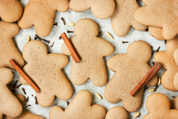 Christmas gingerbread man cookies with spices on white background