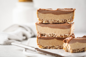 Raw vegan chocolate cashew cake on a light background.