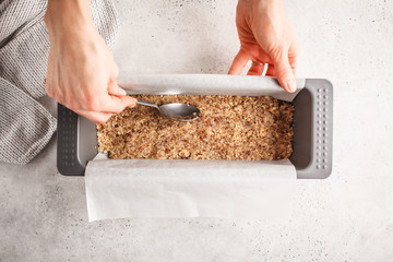 Cooking vegan raw cake, cashew cake on white background.