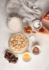 Ingredients for raw vegan cake, cashew cake on a white background.