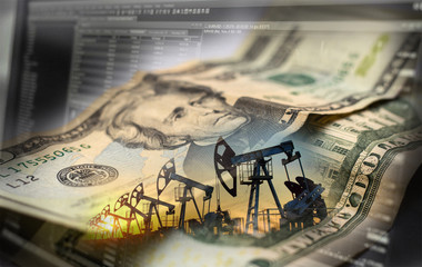 Stock charts and Oil derricks, against the background of a twenty-dollar bill.