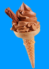 CHOCOLATE ICE CREAM IN CONE WITH CHOCOLATE FLAKE ON BLUE