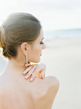Gentle woman posing on beach
