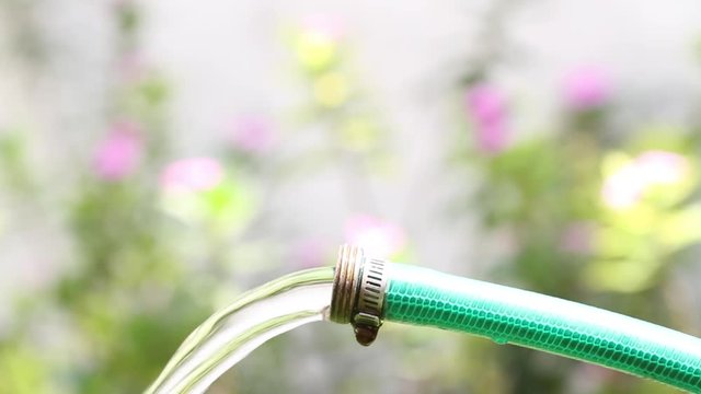 garden hose with water flowing 