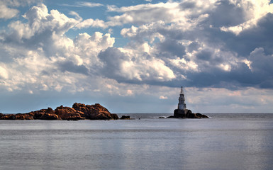 Beautiful landscape with lighthouse and blue sea