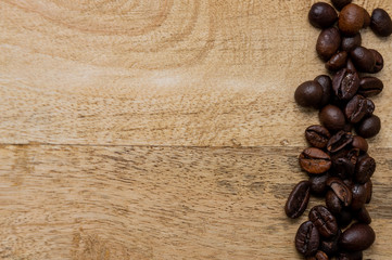 coffee beans on wooden background with copy space for your text