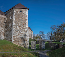 Fototapeta na wymiar Medieval tower of castle in Ljubljana with defensive ditch and bridge, Slovenia