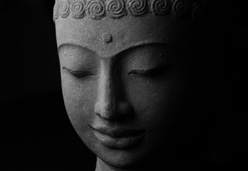 Buddha's face stone sculpture