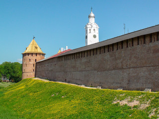 Fototapeta na wymiar Veliky Novgorod. The Western wall of the Novgorod Kremlin and the clock tower