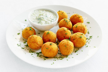 lentil falafels with cacik sauce decorated with dill