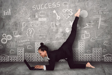 Asian ballerina working with a laptop