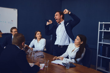Business Team During Brainstorming In Modern Office. Discussing New Business Possibilities. Business In Office Concept.