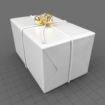 Wrapped christmas gift with golden bells