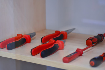 Dielectric red tool for working in existing electrical installations on the stand