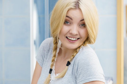 Lovely blonde woman in braids