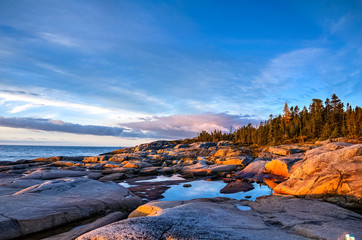 Dawn on the rocks, St-Lawrence river, Quebec, Canada
