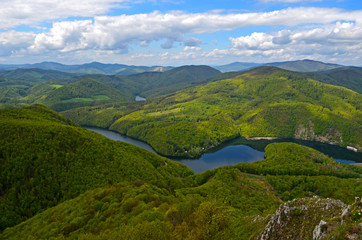 Naklejka na ściany i meble View on green hills and river Ruzin from Sivec Slovakia
