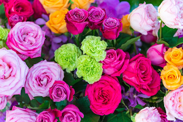 Mixed multi colored roses in floral decor, Colorful wedding flowers background
