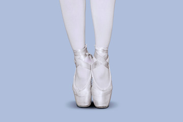 Female ballet dancer feet dancing with tiptoe pose