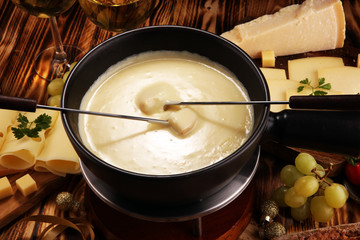 Gourmet Swiss fondue dinner on a winter evening with assorted cheese