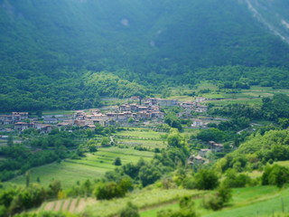 Tilt shift image of mountain village in italy
