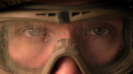 Close-up eyes of caucasian soldier on helmet and camouflage looking straight at camera, calmly, persistent look, power illustration