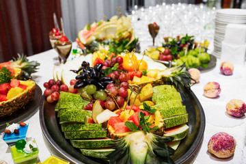 Modern desserts, cupcakes, sweets with fruits. Delicious candy bar.