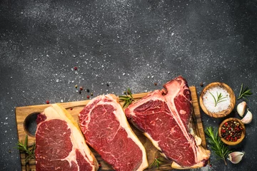 Keuken foto achterwand Steakhouse Raw meat beef steak on black top view.