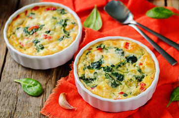 Spinach Red Bell Pepper Baked Omelet with cups of tea and fresh spinach leaves