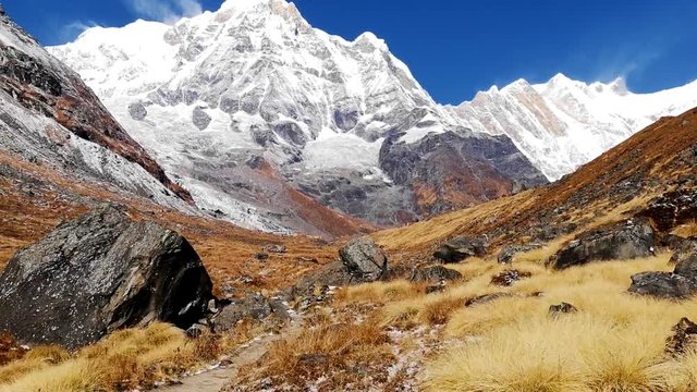 Hiker walking on trekking trail to Annapurna Base Camp, Himalayas, Nepal. POV.