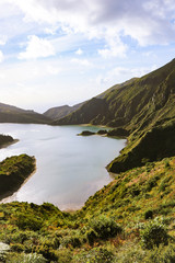 Fototapeta na wymiar Amazing lagoon surrounded by mountains. ancient crater of a volcano. Fire Lagoon Azores island Portugal